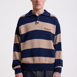 Navy and stone stripe knit polo jumper with Rockport embroidery logo at chest, worn by a model