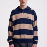 Navy and stone stripe knit polo jumper with Rockport embroidery logo at chest, worn by a model