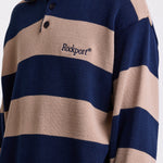 Navy and stone stripe knit polo jumper with Rockport embroidery logo at chest, worn by a model