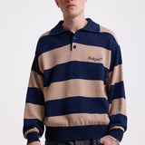 Navy and stone stripe knit polo jumper with Rockport embroidery logo at chest, worn by a model