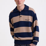 Navy and stone stripe knit polo jumper with Rockport embroidery logo at chest, worn by a model