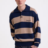 Navy and stone stripe knit polo jumper with Rockport embroidery logo at chest, worn by a model