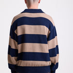 Navy and stone stripe knit polo jumper with Rockport embroidery logo at chest, worn by a model