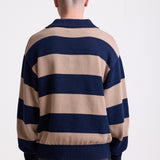 Navy and stone stripe knit polo jumper with Rockport embroidery logo at chest, worn by a model