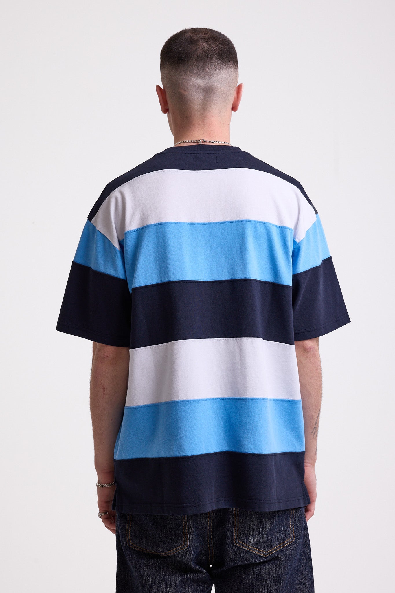 Navy, blue and white stripe crew neck t-shirt with embroidered Rockport logo, worn by model