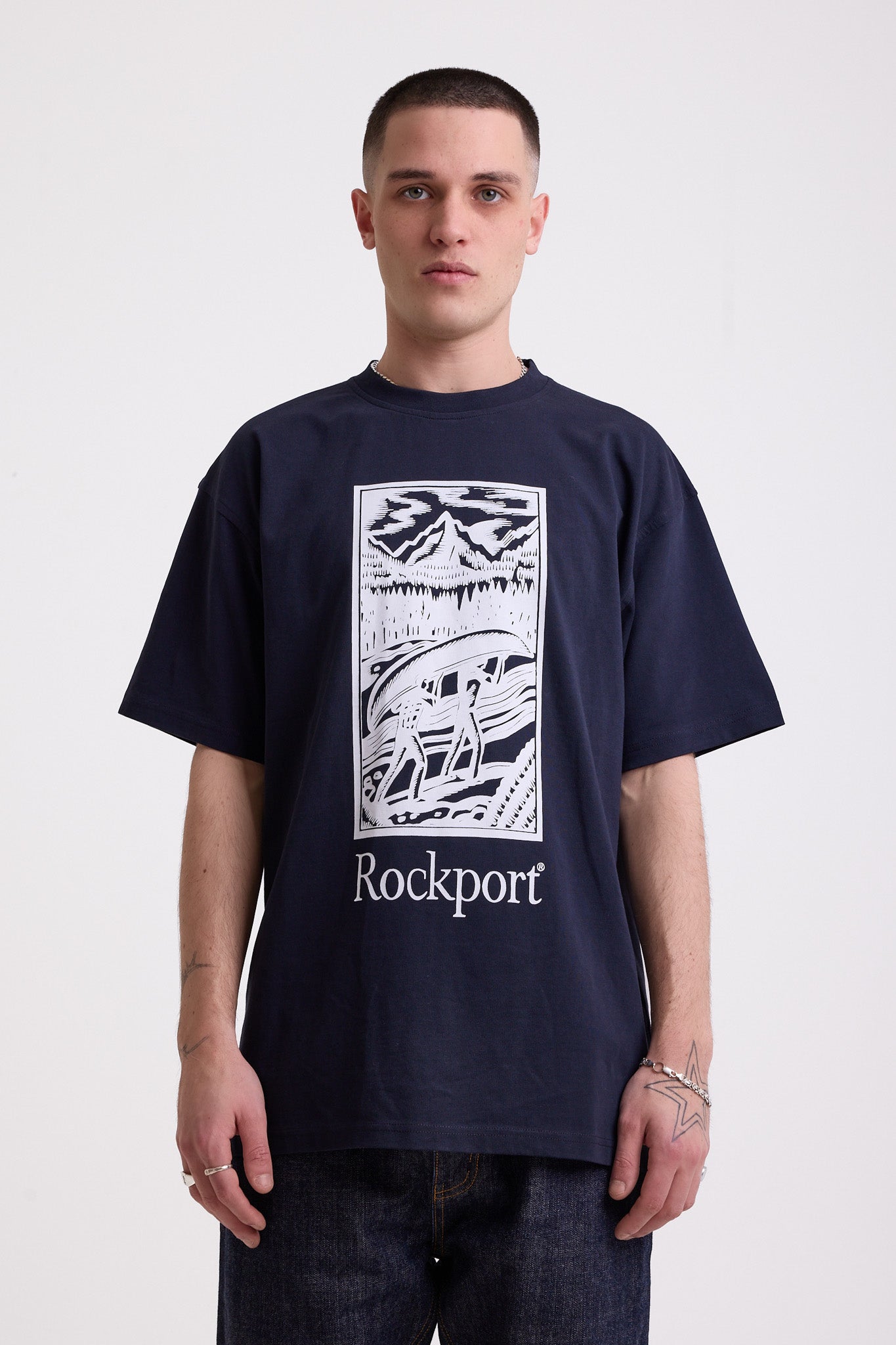 Navy crew neck t-shirt with printed ourdoor-inspired graphic and Rockport logo, worn by model