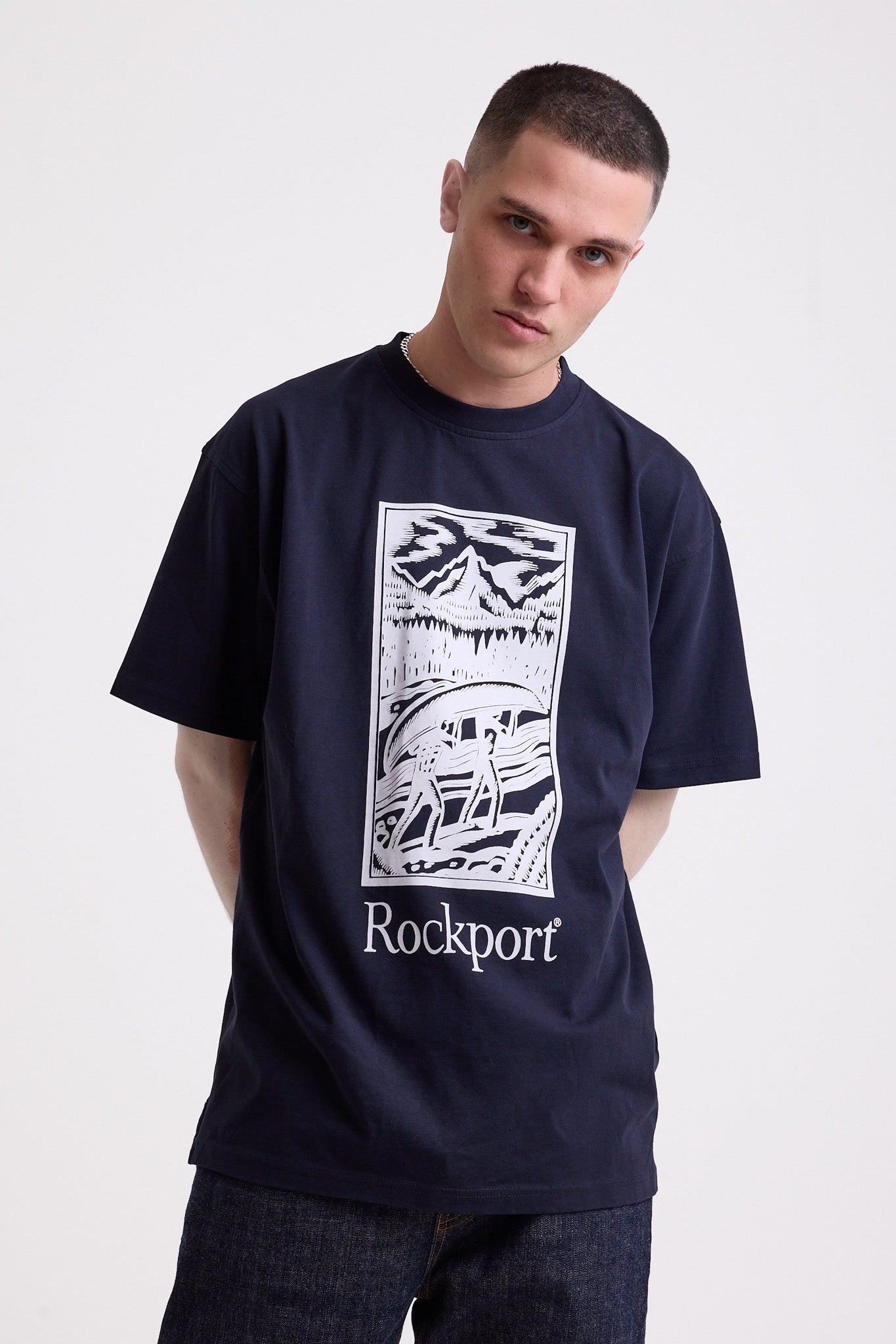 Navy crew neck t-shirt with printed ourdoor-inspired graphic and Rockport logo, worn by model