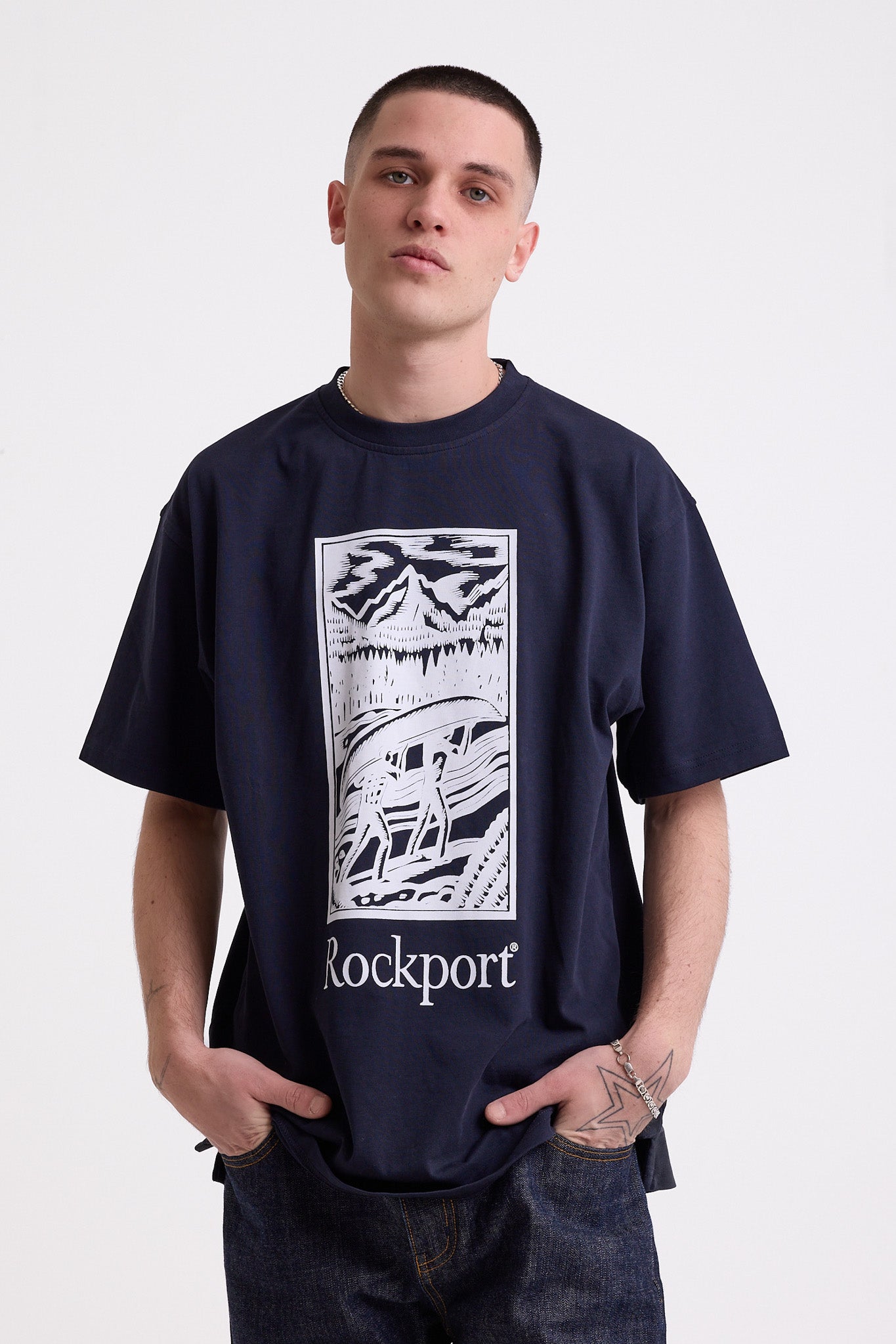 Navy crew neck t-shirt with printed ourdoor-inspired graphic and Rockport logo, worn by model