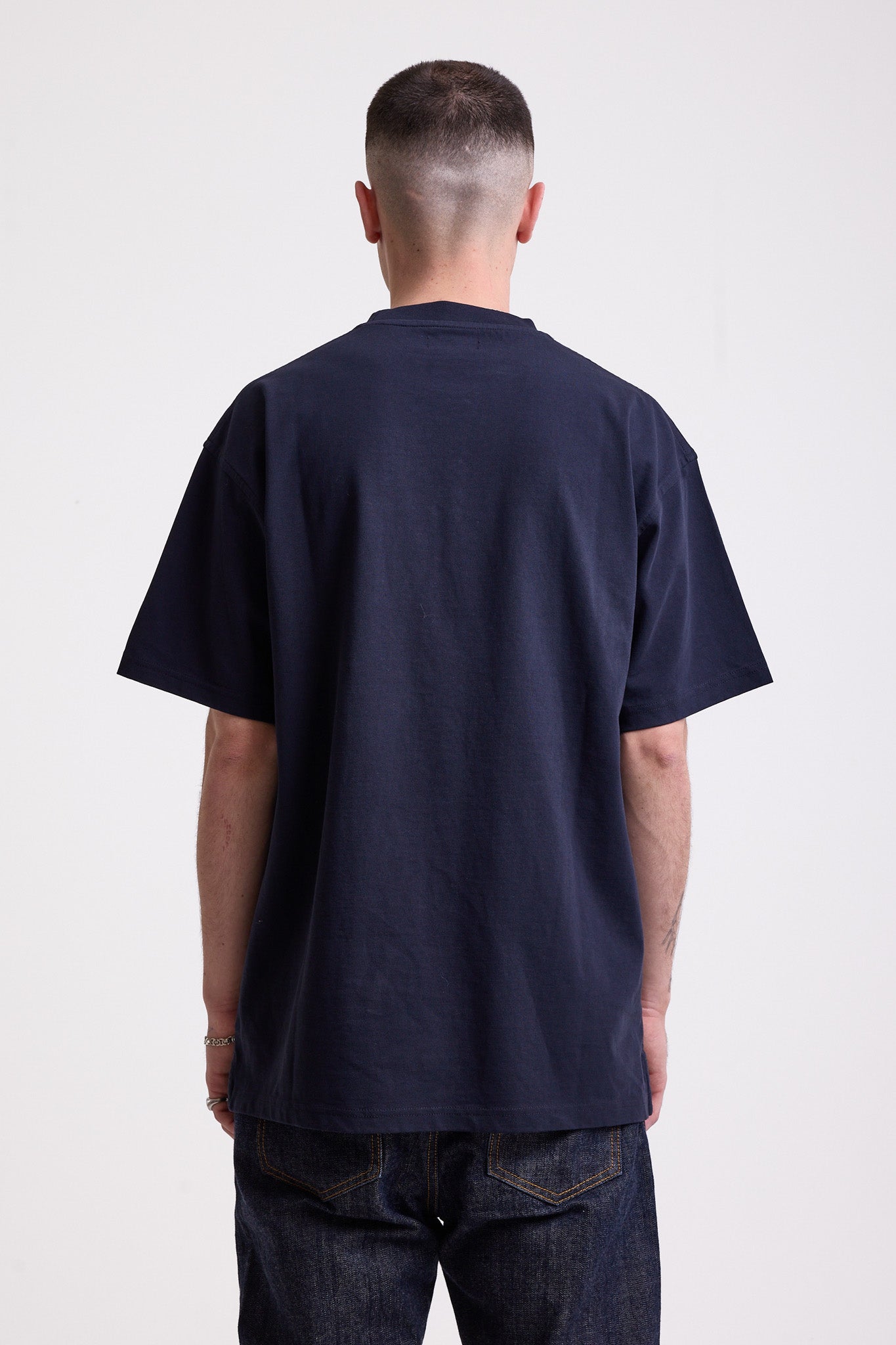 Navy crew neck t-shirt with printed ourdoor-inspired graphic and Rockport logo, worn by model