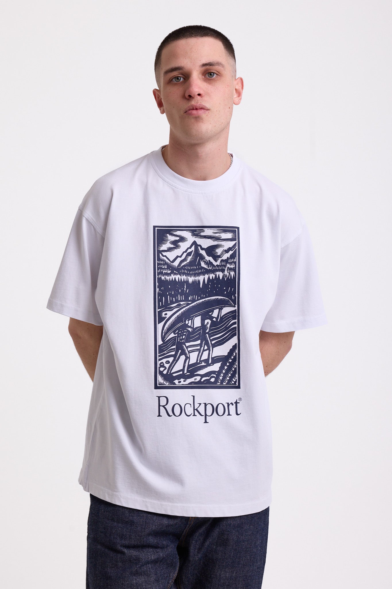 White crew neck t-shirt with printed ourdoor-inspired graphic and Rockport logo, worn by model