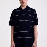 Navy and white striped pique polo shirt with embroidered Rockport logo, worn by model