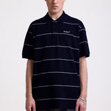 Navy and white striped pique polo shirt with embroidered Rockport logo, worn by model