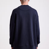 Navy cotton crew neck sweatshirt with embroidered Rockport logo and american flag at chest, worn by model