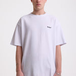 White pique crew neck t-shirt with navy Rockport embroidery, worn by model