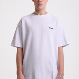 White pique crew neck t-shirt with navy Rockport embroidery, worn by model