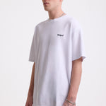 White pique crew neck t-shirt with navy Rockport embroidery, worn by model