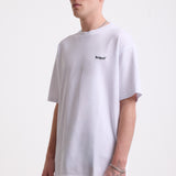 White pique crew neck t-shirt with navy Rockport embroidery, worn by model