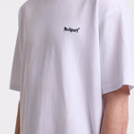 White pique crew neck t-shirt with navy Rockport embroidery, worn by model