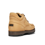 Rockport tan wheat hiker boot with black sole on a white background