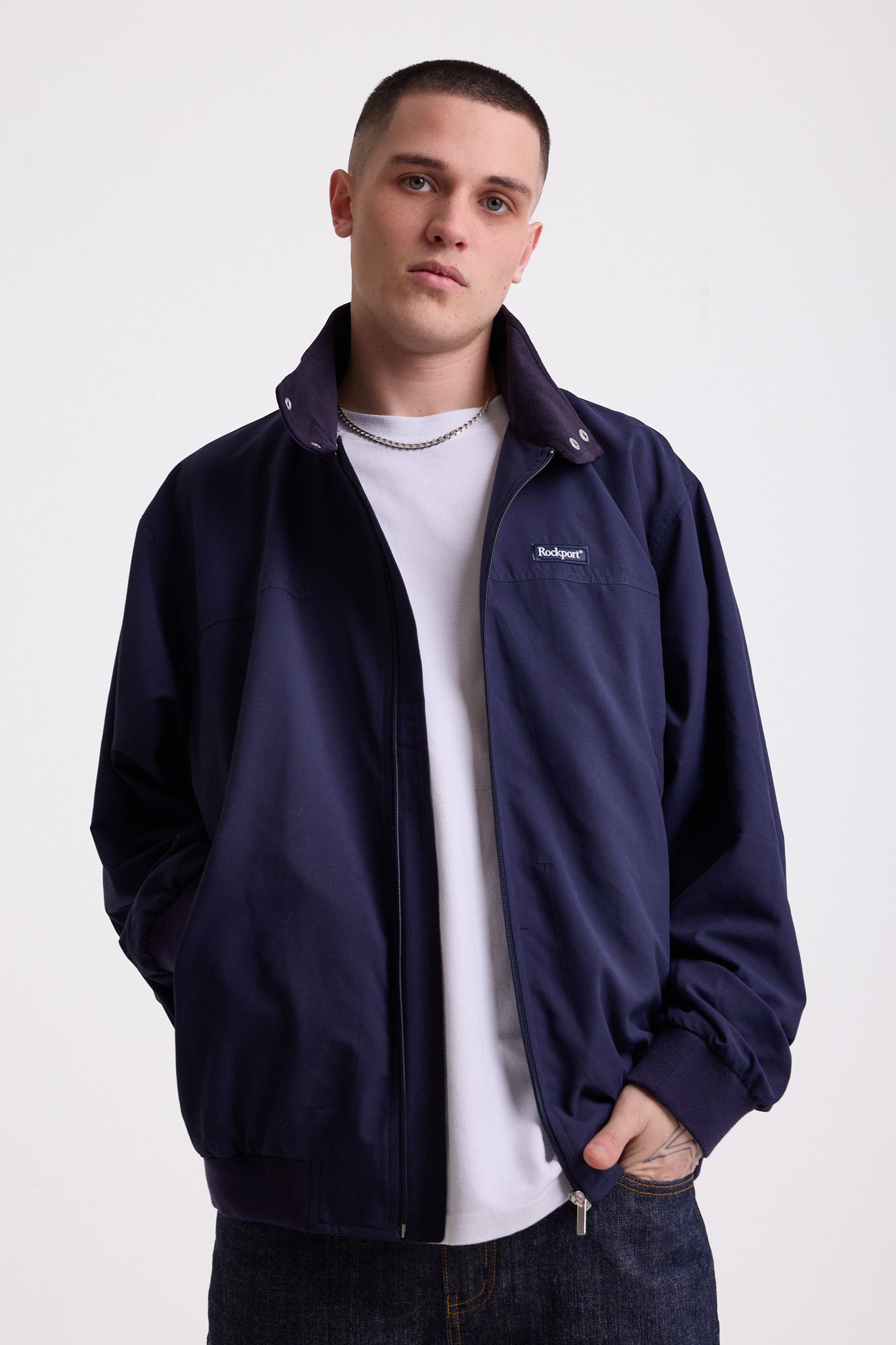 Classic navy harrington jacket with embroidered rockport logo, worn by model