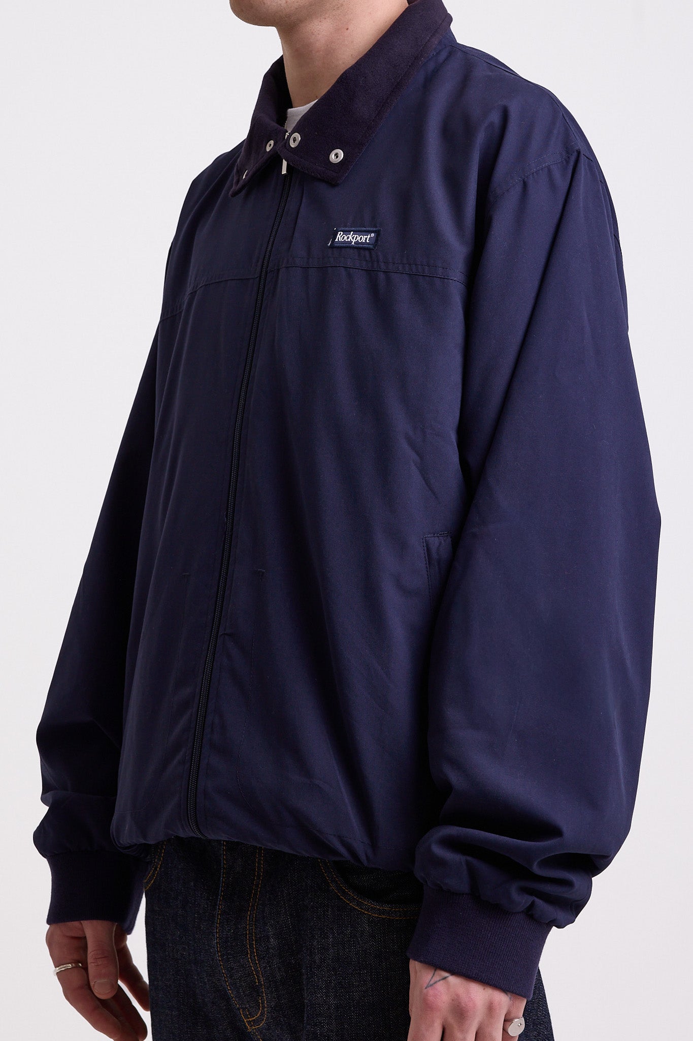Classic navy harrington jacket with embroidered rockport logo, worn by model