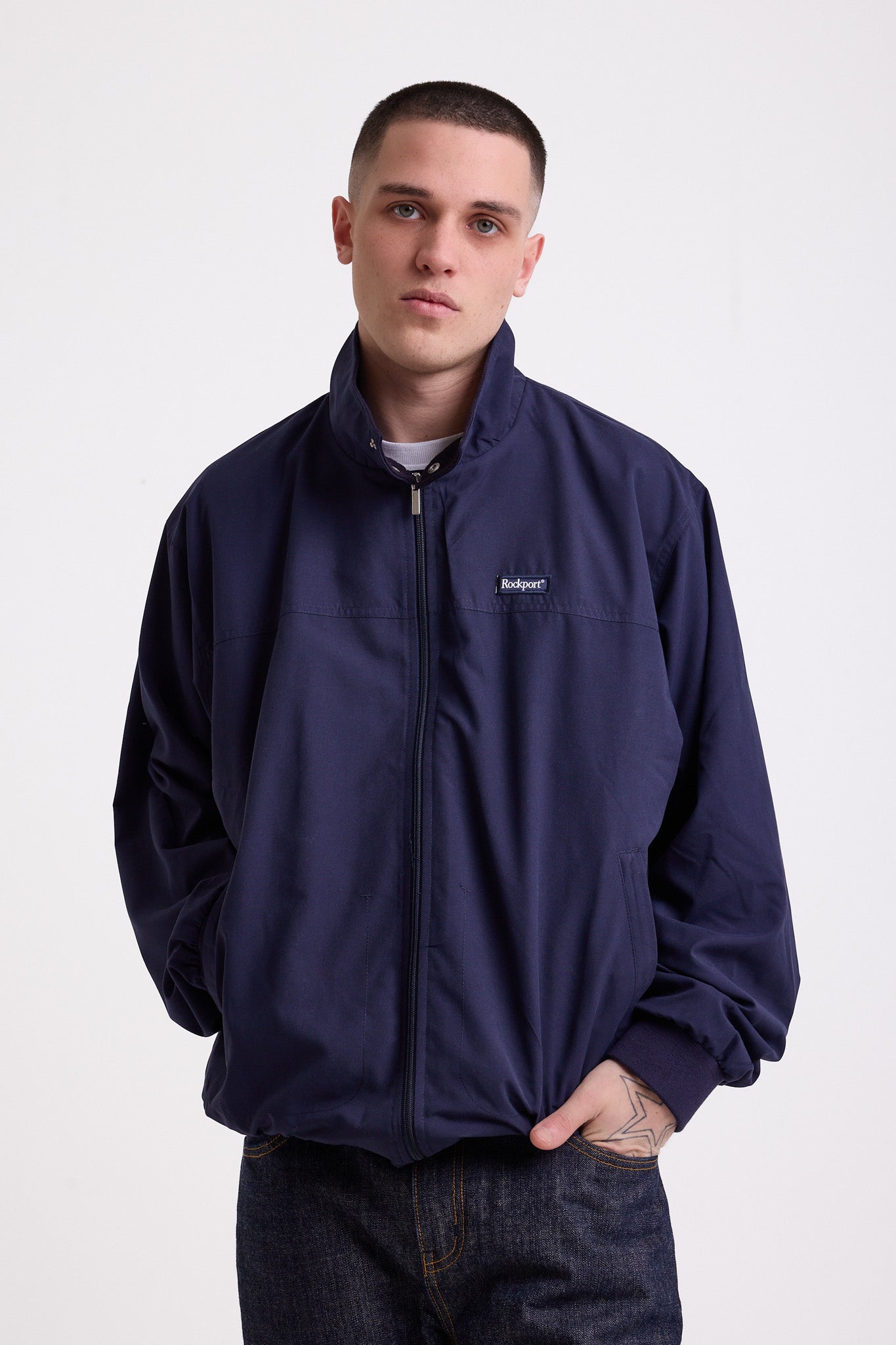 Classic navy harrington jacket with embroidered rockport logo, worn by model