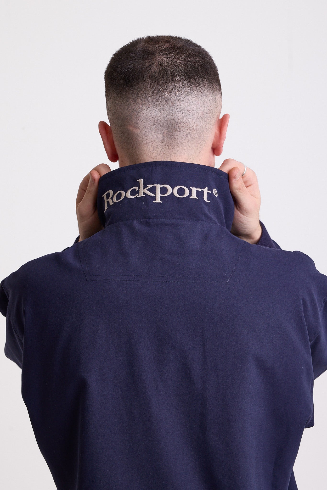 Classic navy harrington jacket with embroidered rockport logo, worn by model
