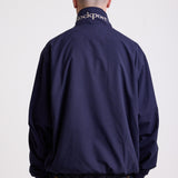 Classic navy harrington jacket with embroidered rockport logo, worn by model