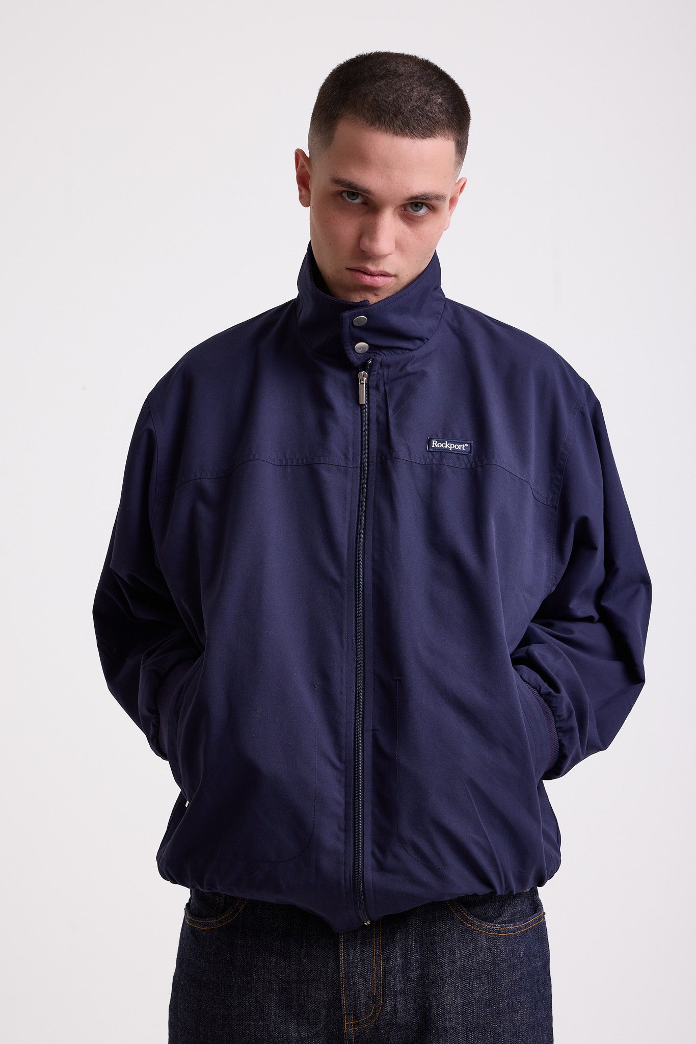 Classic navy harrington jacket with embroidered rockport logo, worn by model